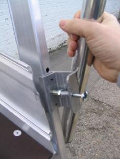 The locking bolts must locate in the holes as shown.