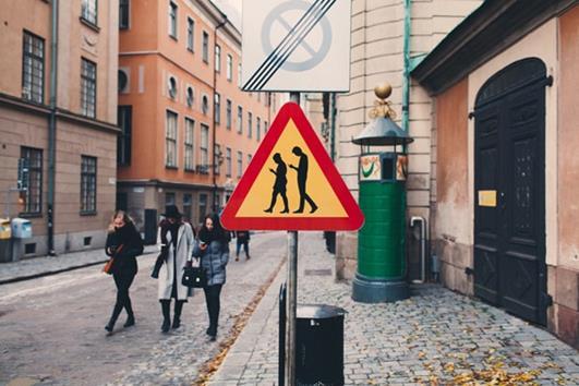 Figure 2-1: In the Swedish capital of Stockholm, traffic signs are used to warn smombies" for the risks of smartphone usage while walking.