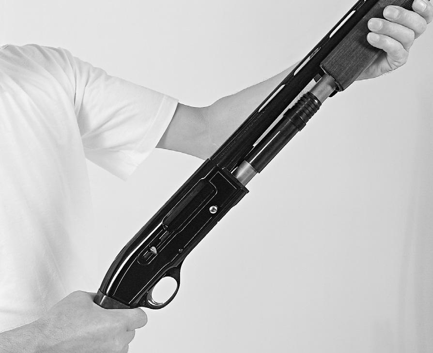 MOUNTING THE FOREARM Pull back the operating handle. The action should stay open. Mount the forearm by carefully sliding it over the magazine tube, and seating it into the receiver. (See Figure 3).