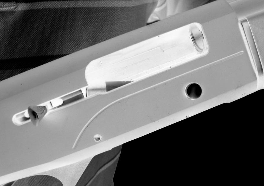LOADING Before loading, move the safety button fully to the right so it is protruding from the right side of the trigger guard indicating the ON (SAFE) position.