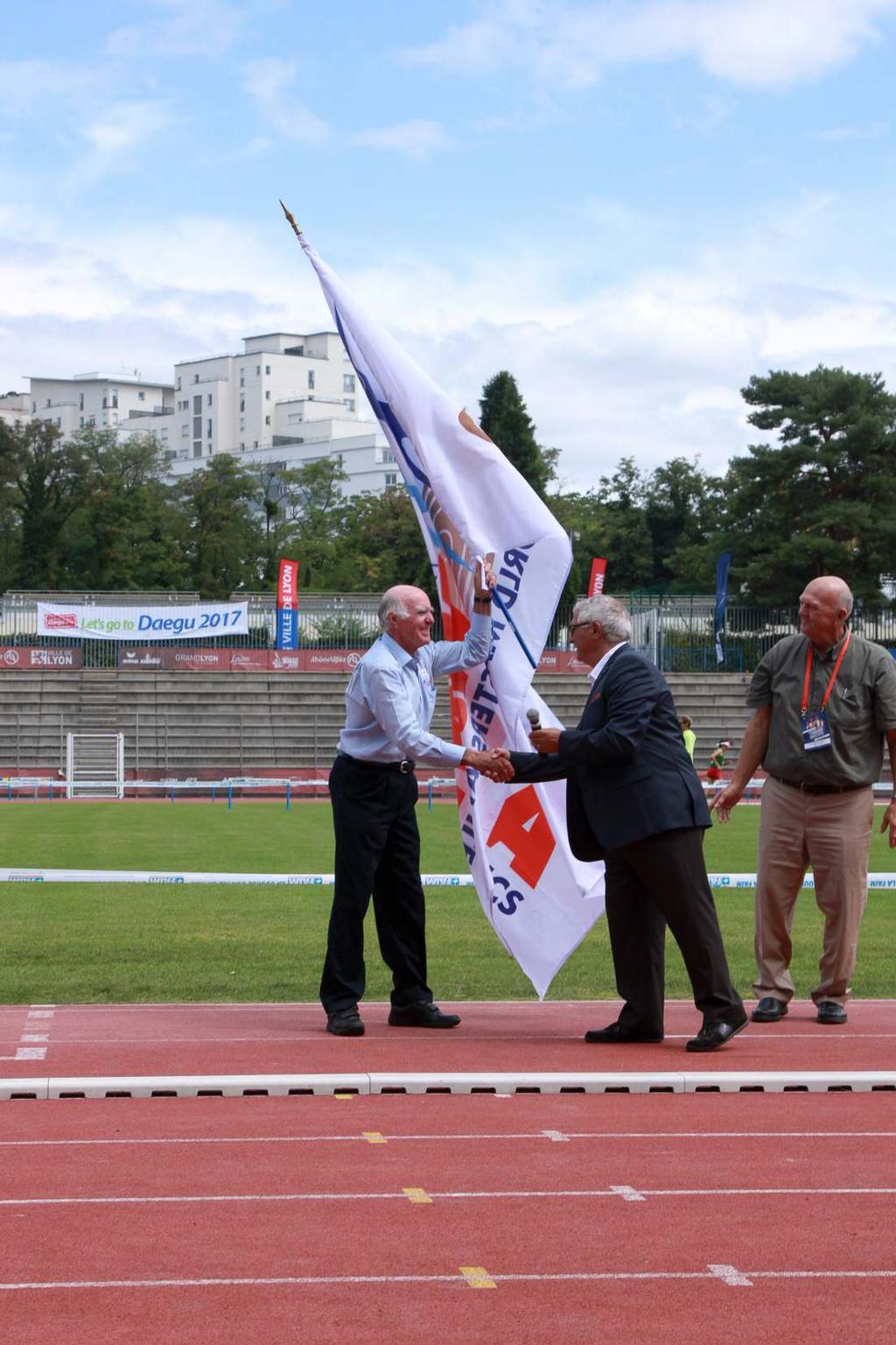Next stop Perth Bob Schickert receives the WMA flag from Marcel Ferrari, President of