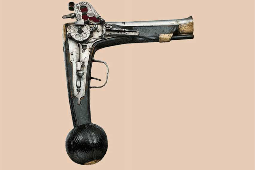 Ca. 1590: Wheel Lock Pistol, Regensburg The wheel lock pistol has an unusual shape with a sharply angled stock, ball knob butt and an iron barrel that has a