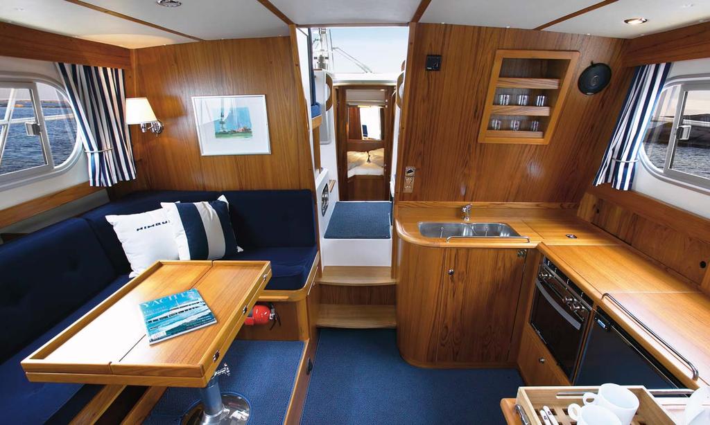 Light and airy, tidy and practical.the saloon features a U-sofa, angled galley and a folding table at the point of maximum beam. flying bridge than the aft ladder.