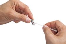 Lightly apply a small amount of DP-40 lubricant to the tip of a cotton swab. 3.
