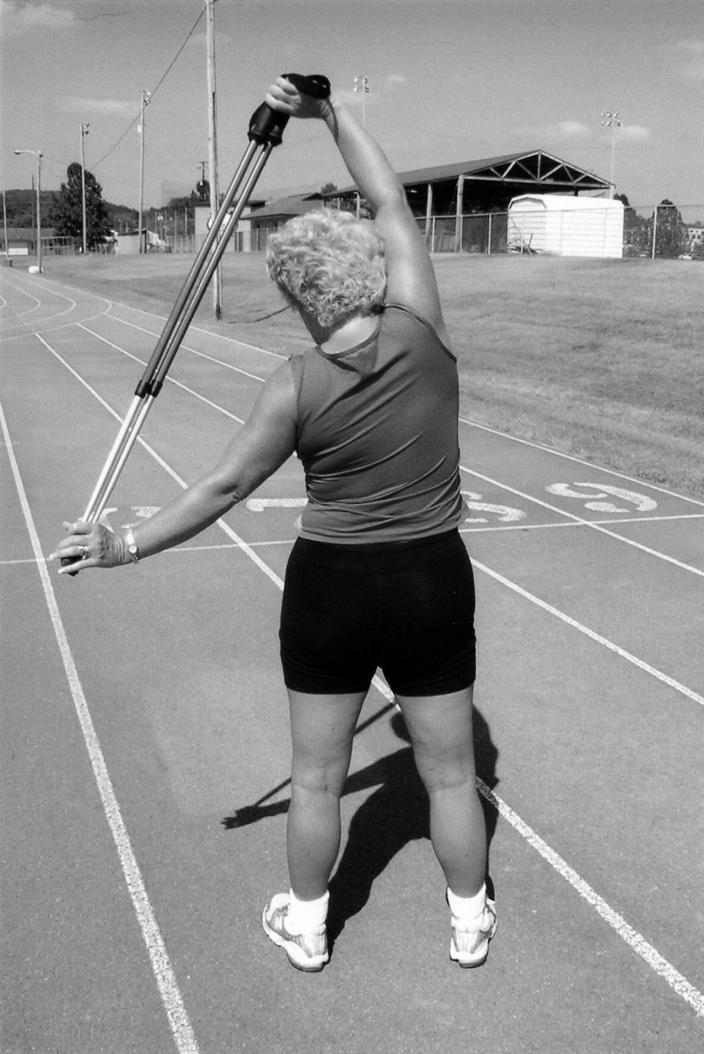 Warm-Up/Cool-Down Stretches 9. Torso/Lateral Twist Grab pole with wide grip overhead. Feet shoulder width apart.