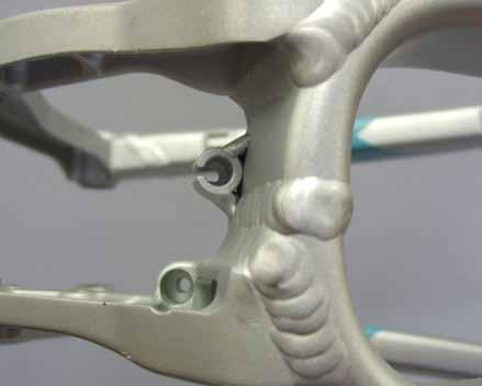 Use the stop closest to the drive side of the bike for Shimano front derailleurs and the stop in the middle of the yoke for Sram derailleurs.