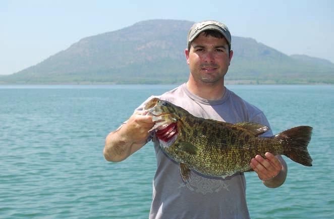 Black Bass Oklahomas most recent state record smallmouth bass caught by Ryan Wasser of Pocasset from Lake Lawtonka on March 31, 2012. The fish weighed 8 pounds, seven ounces.