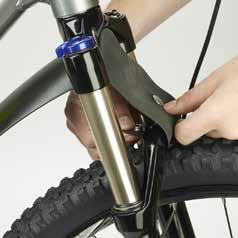 Locate the front mudguard and place the end into the steerer tube.