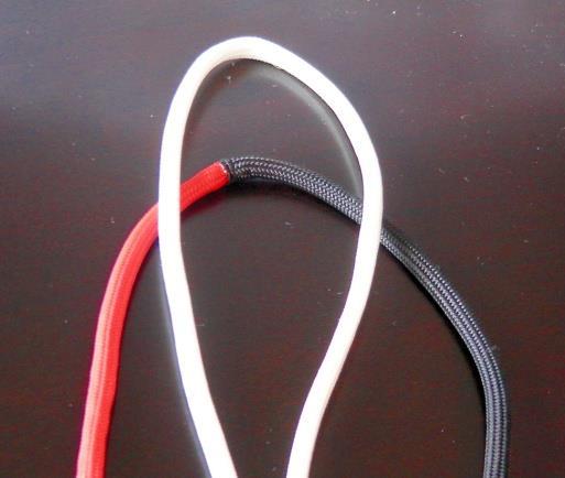 red/black cord in behind the white loop.