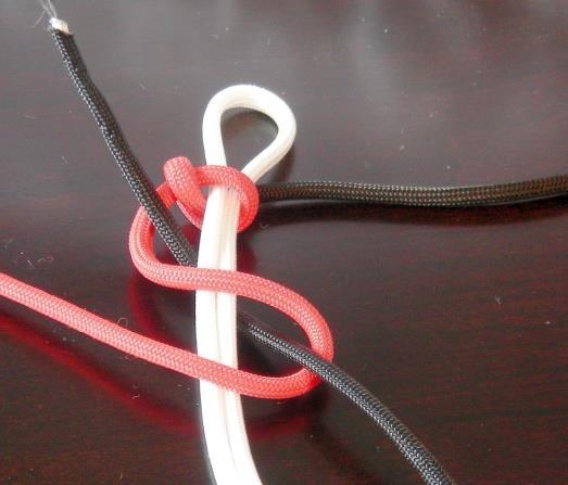 Be sure to leave about a one inch diameter loop for the white cord.