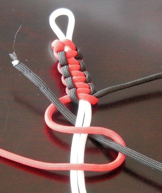 Continue weaving until you reach the overhand knot at the end of your