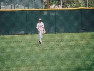 Anderson sliding into 3 rd base before tying up 2003 State T.