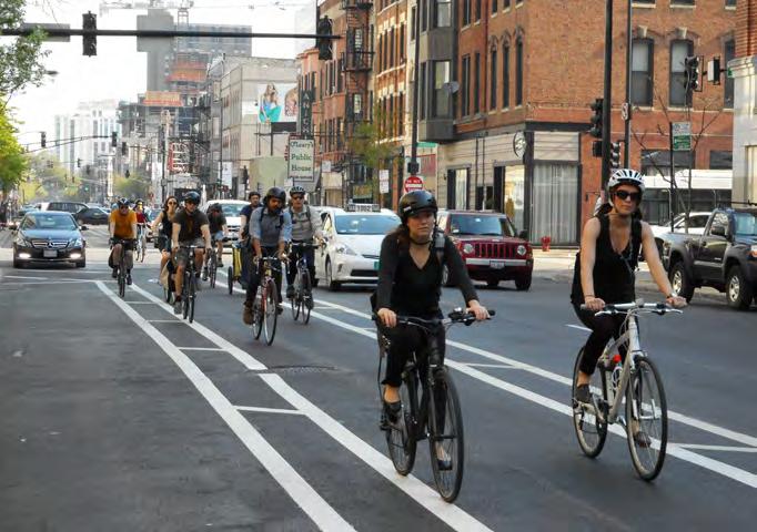 The Wells Street buffer-protected bike lane is an important connection to downtown with several closely spaced signalized intersections.