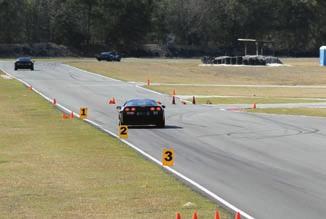In a tight autocross course, students are encouraged to gradually increase their speed and experience what the car feels like when it starts to go over