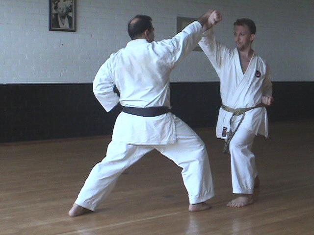 Attack side left side forward front stance. Attack side steps in punching face level.