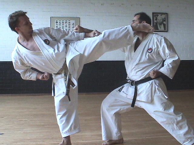 After snapping back take the left leg through the front leg of the attacker against the knee, this puts them