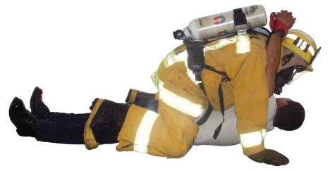 27 FIGURE #6 FIREFIGHTER DRAG WITH ONE RESCUER - Position the victim on his or her back. - Tie the victim s hands together with any available material.