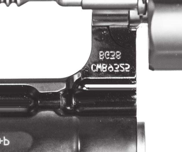 MODEL AND FEATURES IDENTIFICATION The serial number and the model number appear inside the yoke (FIGURE 3) when the cylinder is in the open position.