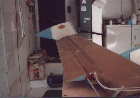 Fitting the wheel pants to the canard. Notice the pitot tube and the fully rigged elevator hinges.