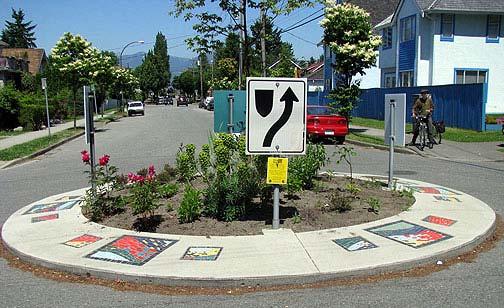 Traffic circles reduce speeds within 100 to 200 feet of an intersection, and if used between 300 feet and 600 feet apart, can effectively reduce average speeds on a street to below 30 mph, and