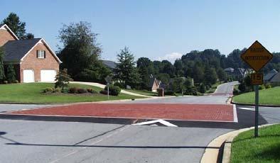The raised intersection may be given a special pavement treatment. The ramp is 10 to 12 feet along the path of the vehicle. Raising the intersection to 3 inches, results in a gentle grade of only 2.