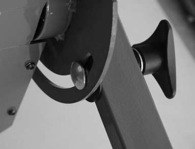between the Tripod Bracket and the U-shape arm as shown.