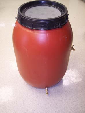 HOW TO MAKE A RAIN BARREL: The orange barrels can hold up to 50 gallons of rainwater. They have a lid and lid-ring similar to a canning jar.