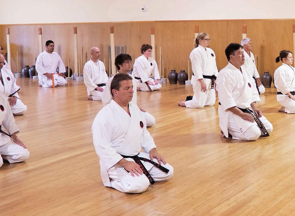Morio Higaonna Sensei and his class meditate before training.