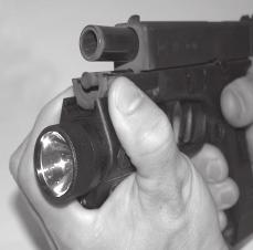 DISMOUNTING PROCEDURES To Dismount the M3X: Be sure the M3X light bulb faces in the same direction of the muzzle of the firearm,