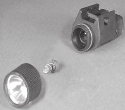 OPERATING PROCEDURES Bulb Replacement: With the M3X dismounted from the firearm and turned OFF, unscrew the bezel counter clockwise until it can be removed from the main body: