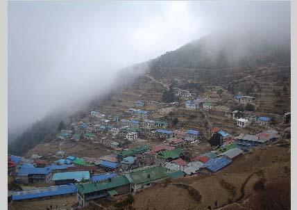 This town lies at approximately 8,000 feet, and it itself is a three or four day walk up from the nearest road. But to save time, we choppered all the way to Namche Bazaar.