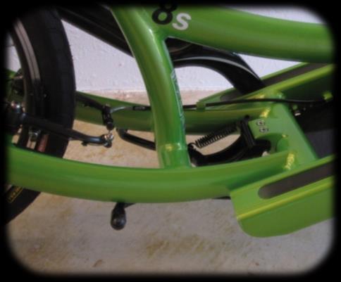 the back of the frame while kicking the kickstand in the forward direction as shown.