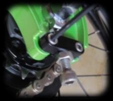 To tension the chain, turn the tensioner screws clockwise pushing the wheel forward.