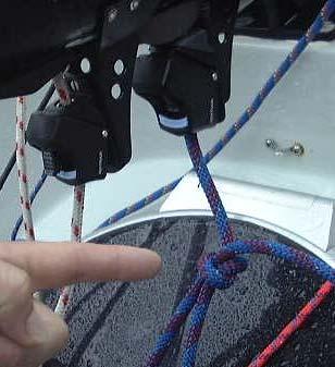 Attach the hook to the jib halyard. 11. Pull in the slack on the jib halyard. 12.