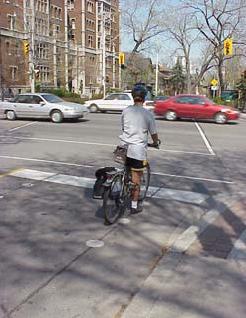 The application of three yellow or white dots on a road has been used in Ottawa and Toronto respectively, with the dots placed at the location where cyclists should position themselves at an