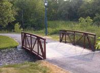 Example of a multi-use trail bridge Bridges should be 0.6 m wider (0.3 m wider on each side) than the trails they are serving to provide adequate side clearance for the railings.