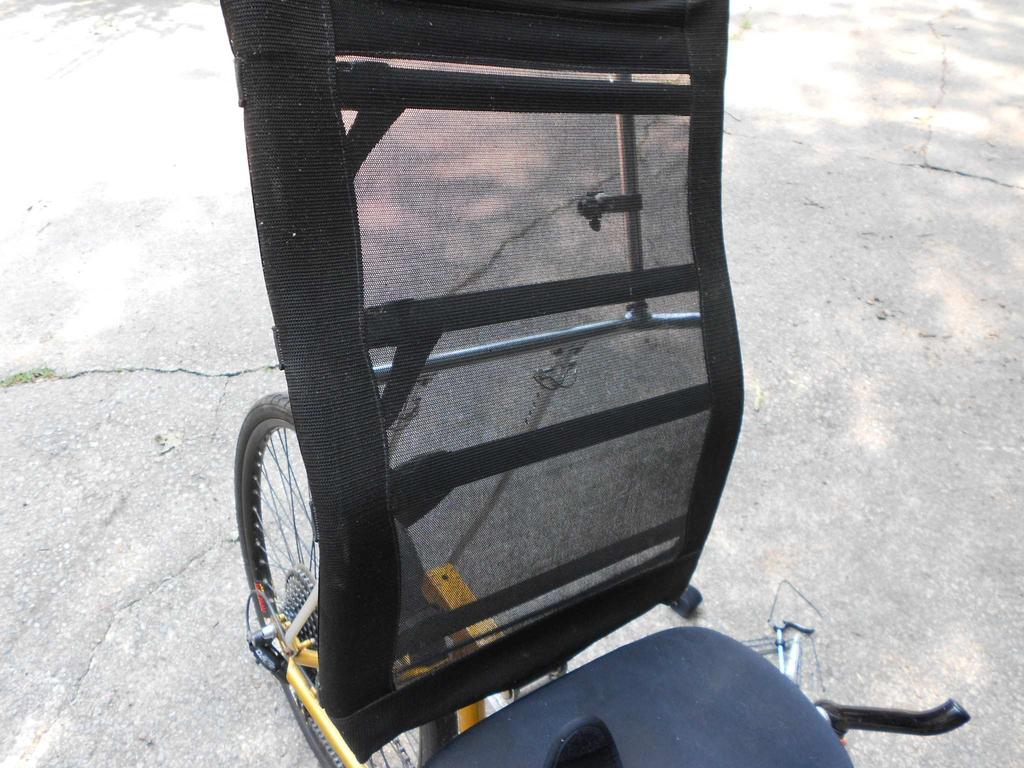 back, with hands on both sides, so that it feels more stable than sitting on an upright bike; it is more comfortable with 2 inches of seating foam and large expansive seat and doesn't require bending