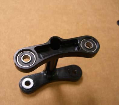Thus, these parts were a combination of structure and eye candy.. The link is a very simple component that, like many on the bike, is forged aluminum with the bearing mounting surfaces machined.