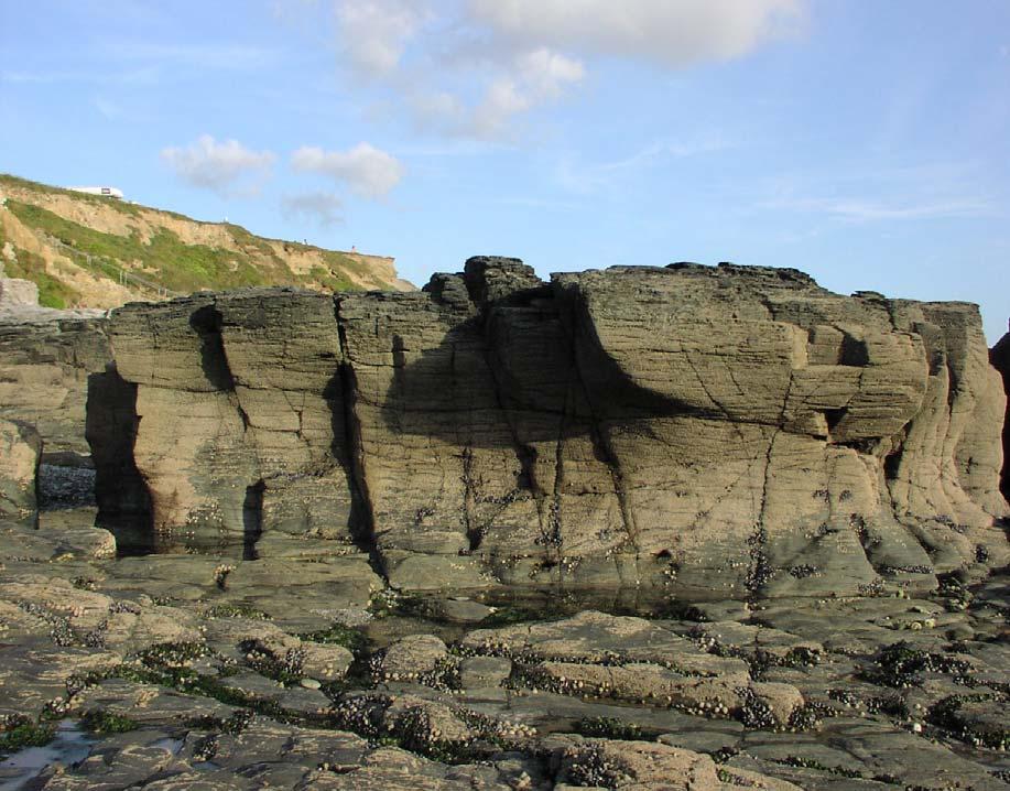Godrevy : Tidal wall 30 31 32 33 34 30 31 32 33 34 30 5b Pull across the pool and climb the arėte direct ** 31 5b The leaning wall with a heel hook to finish 32 5c The corner to a good
