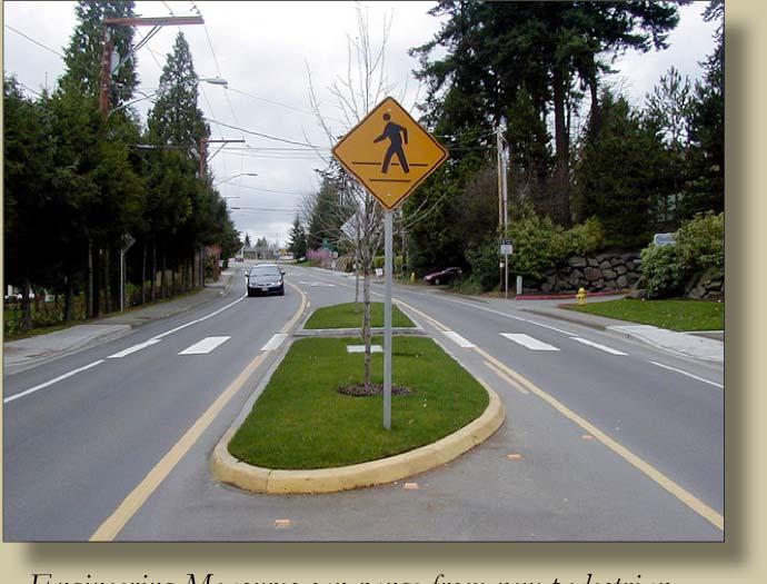 This infrastructure includes signage, stenciling, and traffic control devices such as stop signs, bulb-outs, sidewalks, paths, bike lanes, and trails.