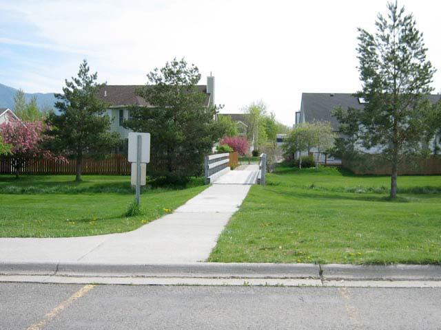 to Emily Dickinson School on the east side connecting Annie Street to Oak Street. There are also several places where drainages require small footbridges to make additional connections.