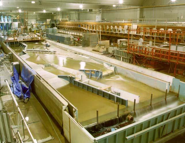 Figure 4.6. Photograph of hydraulics laboratory with river model during testing (center of photograph).