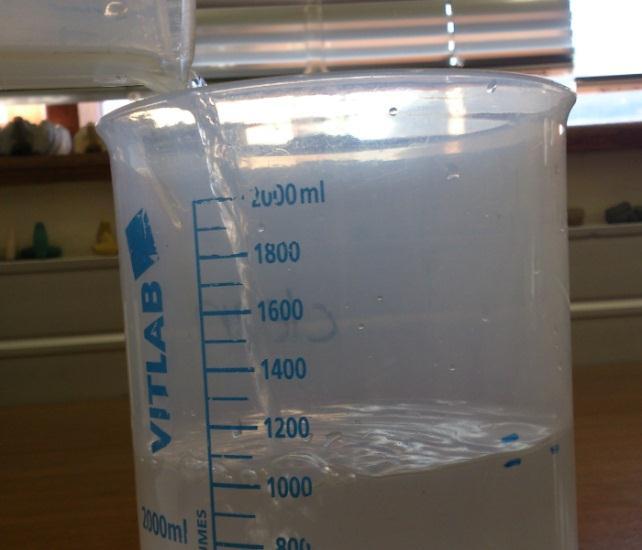 A quick check was done to ensure that the water level had indeed dropped back to its initial level. An additional water measuring container, calibrated in increments of 10 ml, was filled up to 100 ml.