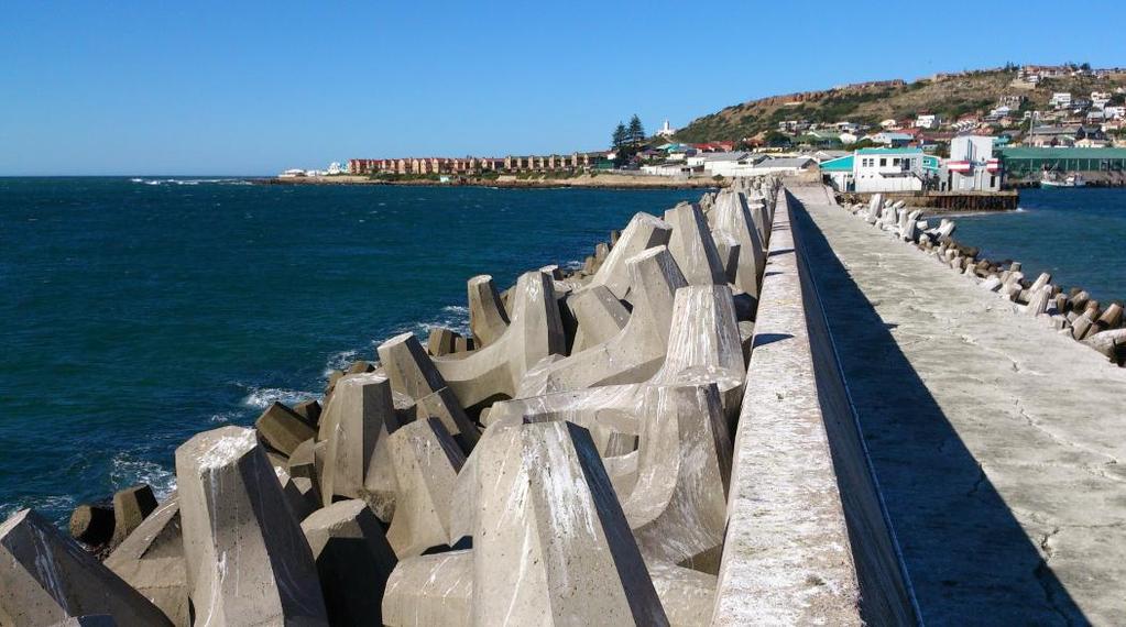 FIGURE 3.3: WATER DEPTHS AROUND MOSSEL BAY BREAKWATER RELATIVE TO CD - ADAPTED FROM TNPA (2014B) While walking along the Mossel Bay breakwater, evidence of breakwater damage could be seen.