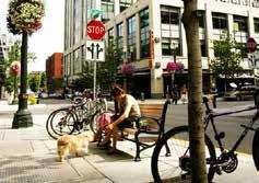 Street Furniture: The use of street furniture - including benches, newspaper kiosks, utility poles, and bollards - can be helpful to establish a more defined pedestrian space outside of the roadway
