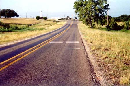 Rumble strips are 117 ft (35.6 m) from the sign.