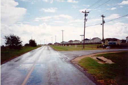 RM 150 is a two-lane rural road with 11 ft (3.4 m) wide lanes and no shoulders. Most intersections on RM 150 are small driveways ranging from 10 to 27 ft (3.1 to 8.2 m) wide.