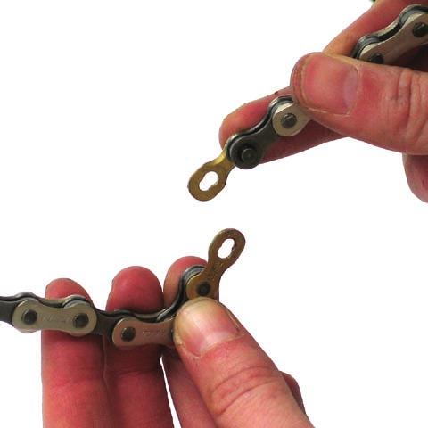 position (fig 15b arrows). Note: Make sure the chain is not twisted inside the tubes.