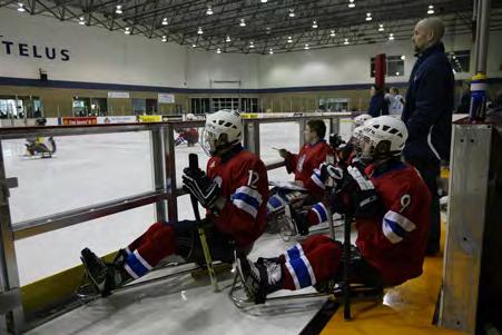 The photo on the left shows Norwegian players in a bench area which has been retrofitted for sledge hockey.