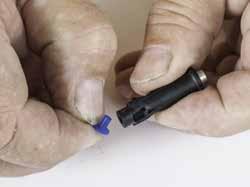 22) Using a flat blade screwdriver, loosen the inlet nipple, (5), enough so that it can be pushed from the main tube,